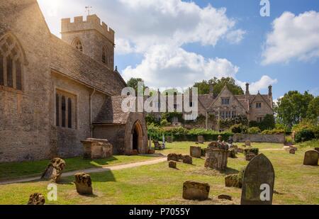 Church and manor at Asthall, Cotswolds, Oxfordshire, England Stock Photo