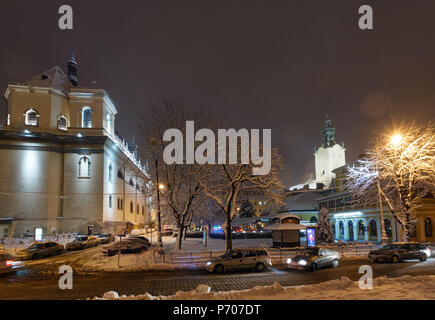 LVIV, UKRAINE - FEBRUARY 04, 2018: Beautiful night winter cityscape in the center of Lviv city. Some lens flare flrom lamps available. Stock Photo