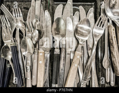 Old cutlery om market stall Stock Photo