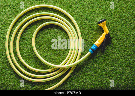top view of hosepipe on grass, minimalistic conception Stock Photo