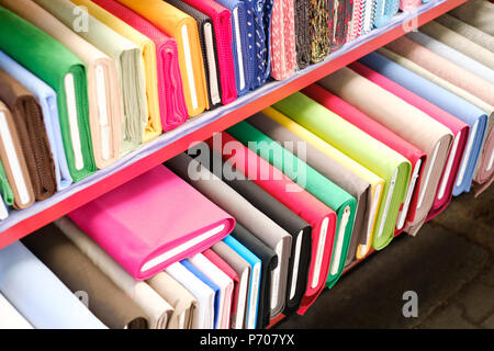 colorful fabric rolls on textile market Stock Photo
