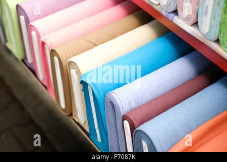 colorful fabric rolls on textile market Stock Photo