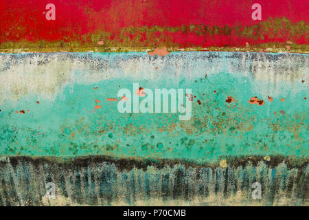 Background of rusty, red, blue, turquoise, black, yellow coloured metal surface. Stock Photo