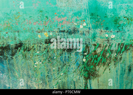 Background of rusty, green, blue and turquoise coloured metal surface. Stock Photo