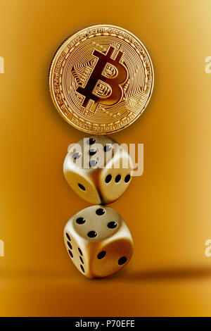 Golden Bitcoin and dice Stock Photo
