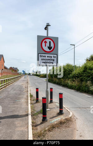 A 'Give way to oncoming vehicles' sign in Blackpool, Lancashire Stock Photo