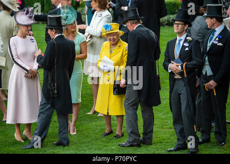 HM The Queen views the racing from the paddock enclosure with other members of the Royal family on the first day of Royal Ascot. Stock Photo