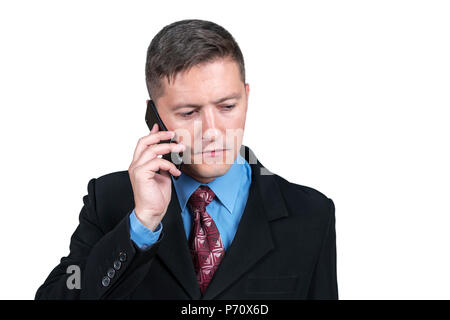 Portrait of serious businessman talking on smartphone, isolated on white background Stock Photo