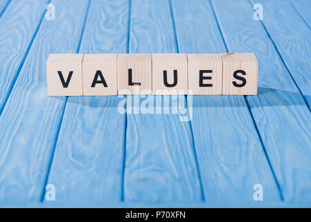 close up view of values word made of wooden blocks on blue tabletop Stock Photo