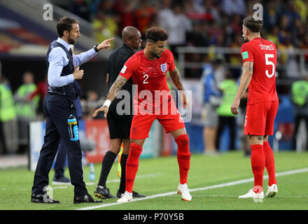 England manager Gareth Southgate (left) gives instructions to Kyle Walker (centre) and John Stones during the FIFA World Cup 2018, round of 16 match at the Spartak Stadium, Moscow. Stock Photo