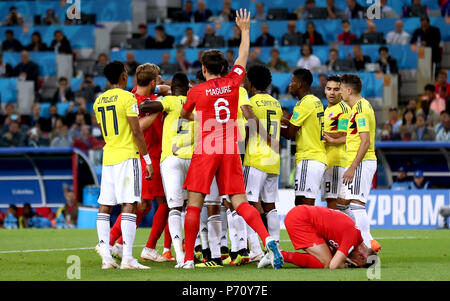 Tempers flare whilst England's Jordan Henderson (bottom right) crouches on the floor after being head butted by Colombia's Wilmar Barrios during the FIFA World Cup 2018, round of 16 match at the Spartak Stadium, Moscow. Stock Photo