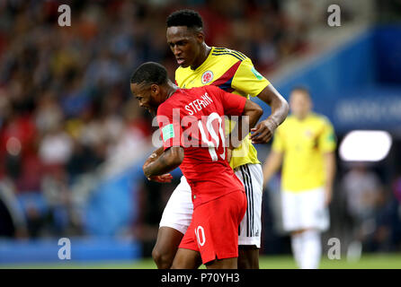 England's Raheem Sterling (front) and Colombia's Yerry Mina appear to clash during the FIFA World Cup 2018, round of 16 match at the Spartak Stadium, Moscow. Stock Photo