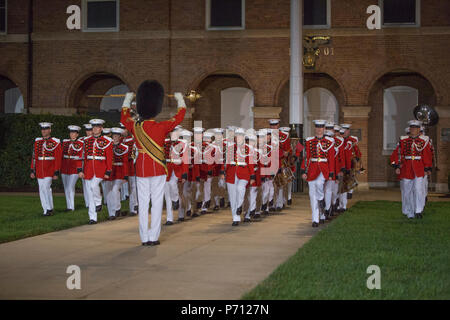 U.S. Marines with 'The Presidents Own' United States Marine Band perform during an evening parade at Marine Barracks Washington, Washington, D.C., Aug. 18, 2017. Evening parades are held as a means of honoring senior officials, distinguished citizens and supporters of the Marine Corps. Stock Photo