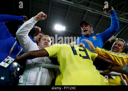 Colombia's Yerry Mina hugs fans in the crowd as he celebrates scoring his side's first goal of the game during the FIFA World Cup 2018, round of 16 match at the Spartak Stadium, Moscow. Stock Photo