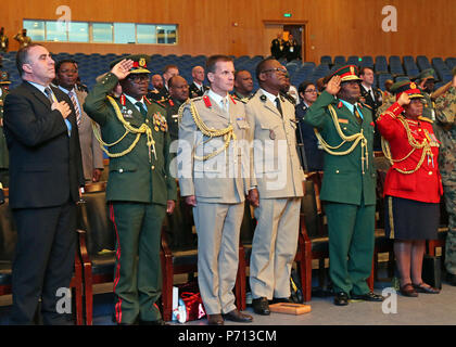 Senior leaders from the U.S., United Kingdom, France, Brazil and 38 nations across the African continent stand for Malawi’s national anthem during the closing ceremony of African Land Forces Summit 2017, in Lilongwe, Malawi, May 11, 2017. ALFS is an annual, weeklong seminar bringing together land force chiefs from across Africa for candid dialog to discuss and develop cooperative solutions to regional and transregional challenges and threats. Stock Photo