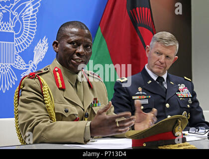 Gen. Griffin “Spoon” Phiri (left), Malawi Defense Force chief of staff, and Maj. Gen. Joseph Harrington, commander of U.S. Army Africa, answer questions during a press conference after the conclusion of African Land Forces Summit 2017, in Lilongwe, Malawi, May 11, 2017. ALFS is an annual, weeklong seminar bringing together land force chiefs from across Africa for candid dialog to discuss and develop cooperative solutions to regional and transregional challenges and threats. Stock Photo