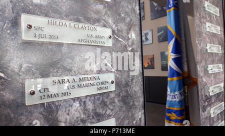 U.S. Army Spc. Hilda Clayton and U.S. Marine Corps Cpl. Sara Medina's name plaques are displayed in the Defense Information School's Hall of Heroes at Fort George G. Meade, Md., May 11, 2017. The Hall of Heroes is a place where public affairs military members from all branches are forever immortalized on individual plaques that bear their names, marking their final resting place in American military history. Stock Photo