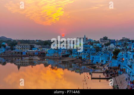 Pushkar Holy Lake at sunset.  Pushkar Lake or Pushkar Sarovar is located in the town of Pushkar in Ajmer district of the Rajasthan state of western In Stock Photo