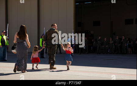 U.S. Marine Corps Capt. Braden Cummins, an AV-8B Harrier II pilot assigned to Marine Attack Squadron (VMA) 311, returns to Marine Corps Air Station Yuma, Ariz., after a deployment with the 11th Marine Expeditionary Unit Thursday, May 11, 2017. The 11th MEU embarked mid-October 2016 aboard the Makin Island Amphibious Ready Group, trained alongside armed forces from foreign nations, and supported operations throughout the Western Pacific, Middle East, and Horn of Africa. Stock Photo