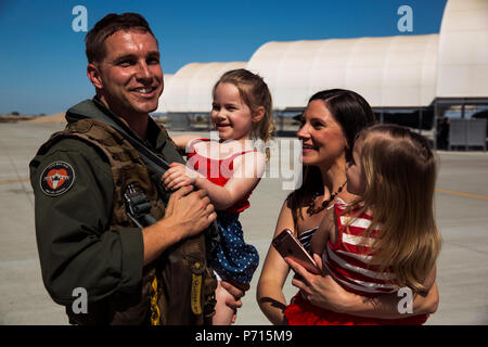 U.S. Marine Corps Capt. Braden Cummins, an AV-8B Harrier II pilot assigned to Marine Attack Squadron 311 (VMA-311), returns to Marine Corps Air Station Yuma, Ariz., after a deployment with the 11th Marine Expeditionary Unit Thursday, May 11, 2017. The 11th MEU embarked mid-October 2016 aboard the Makin Island Amphibious Ready Group, trained alongside armed forces from foreign nations, and supported operations throughout the Western Pacific, Middle East, and Horn of Africa. Stock Photo