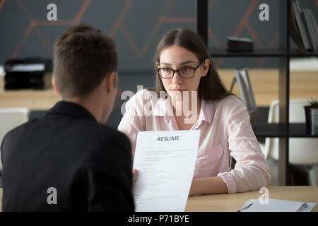 Female applicant waiting for recruiter decision on her candidatu Stock Photo