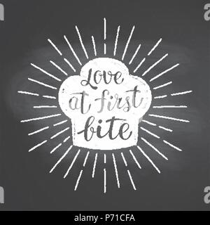 Chef's toque chalk silhoutte with  sun rays and lettering -Love at first bite - on blackboard. Good for cooking logotypes, bades or posters. Stock Vector