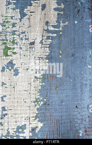 Background of old distressed wood board with peeling paint Stock Photo