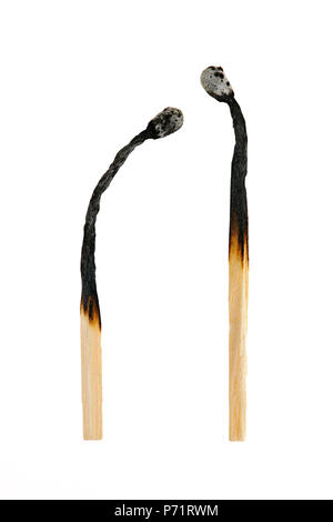 Two burned out wooden matches isolated on white background Stock Photo