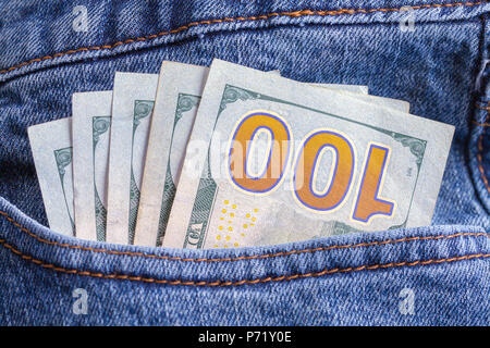 Blue Jean Pocket Full of One Hundred Dollar Bills. Stock Photo