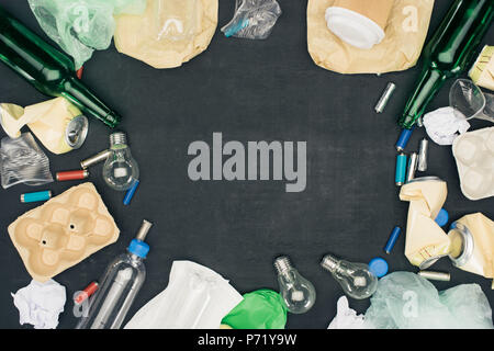 frame of various types of trash on black Stock Photo