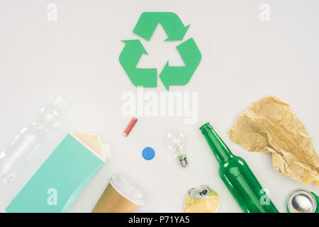 top view of variation of types of trash with recycle sign on white Stock Photo