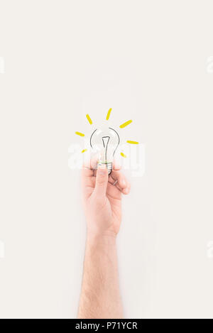 cropped shot of man holding light bulb with drawn glass and light rays Stock Photo