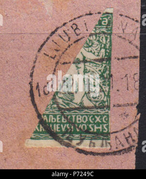 English: Bisected postage stamp from the second Verigar issue of Kingdom of the Serbs, Croats and Slovenes, 10 para, 1921, Ljubljana cancellation :      ''  ,   , 10 , 1921,   . 1921 27 KingdomSHSverigar10para1921bisect-ljubljana Stock Photo