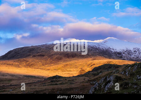 A view of the snow capped Mount Snowdon from Lyln Gwyant valley Stock ...