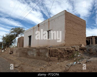 Jagüé, La Rioja, Argentina - 2018: Typical adobe house at the town main street. All houses in this town are made of adobe. Stock Photo