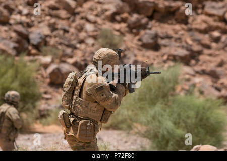 Spc. Ian Douglas, an infantryman from Ellwood, Pennsylvania, assigned to Headquarters and Headquarters Company, 3rd Battalion, 8th Cavalry Regiment, 3rd Armored Brigade Combat Team, 1st Cavalry Division, engages targets at a squad live-fire exercise May 11 in Wadi Shadiya, Jordan as part of Exercise Eager Lion 2017. Eager Lion was a two-week-long multinational exercise with the Hashemite Kingdom of Jordan, in order to exchange military expertise and improve interoperability among partner nations. Stock Photo