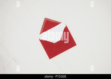 top view of opened red envelope with blank paper isolated on white Stock Photo