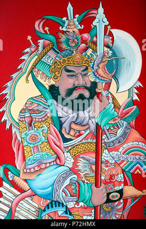 Guardian figure paintings on gate, Hoi Tuong Te Nguoi Hoa Buddhist Chinese temple, Phu Quoc, Vietnam, Indochina, Southeast Asia, Asia Stock Photo