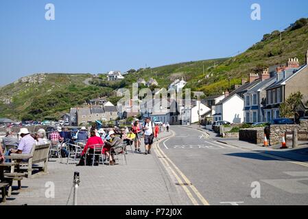 A busy Sennen Cove village on a hot summers day Cornwall England UK Stock Photo