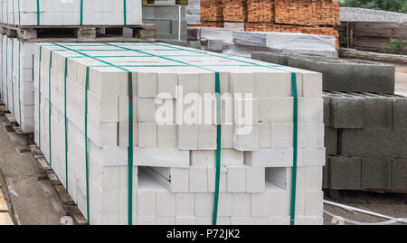 White bricks stacked on pallets Stock Photo