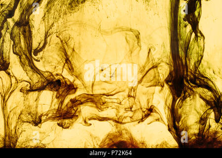 full frame of yellow paint splashes and swirls Stock Photo
