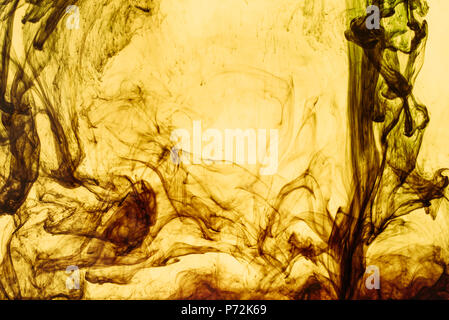 full frame of yellow paint splashes and swirls Stock Photo