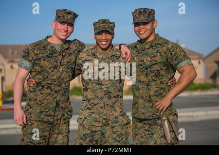 CAMP PENDLETON, California (May 11, 2017) U.S. Marines with Battalion Landing Team (BLT) 1st Bn., 4th Marines, 11th Marine Expeditionary Unit, pose for a picture aboard Camp Pendleton, Calif., May 11. The BLT is the ground combat element for the 11th MEU and consists of an infantry battalion, which is reinforced with an artillery battery, amphibious assault vehicle platoon, combat engineer platoon, reconnaissance platoon, M1A1 Tank platoon, and a light armored reconnaissance vehicle platoon. The 11th MEU is returning to Southern California after a seven-month deployment to the Western Pacific, Stock Photo