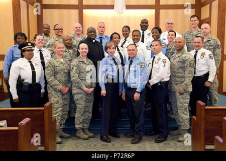 Members of the 436th Security Forces Squadron, Philadelphia Police Department, Philadelphia, Pa., and Base Chapel staff, pose for a group photo May 11, 2017, at Dover Air Force Base, Del. Fifteen members of the police department toured the 436th SFS, Air Force Mortuary Affairs Operations and Base Chapel during their five-hour visit to the base. Stock Photo