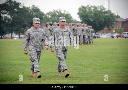 Maj. Gen. Kevin W. Mangum (left), commander of the U.S. Army Aviation Center of Excellence, marches with Col Brian D. Bennett, the former commander of the 1st Aviation Brigade, during a change of command ceremony at Howze Field, Fort Rucker, Ala. June 14, 2013.  Bennett relinquished command of the 1st Aviation Brigade to Col. Shawn Prickett during the ceremony. Stock Photo