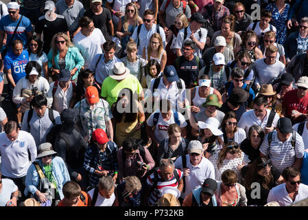 London, UK. 3rd July, 2018. Spectators are led into the grounds by security guards of the Wimbledon Tennis Championships 2018, Day 2. London, United Kingdom, 03 July 2018 Credit: Raymond Tang/Alamy Live News Stock Photo
