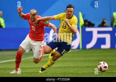 St. Petersburg, Russland. 03rd July, 2018. Gustav SVENSSON (SWE), action, duels versus Josip DRMIC (SUI). Sweden (SWE) - Switzerland (SUI) 1-0, Round of 16, Round of 16, Game 55, on 07/03/2018 in Saint Petersburg, Arena Saint Petersburg. Football World Cup 2018 in Russia from 14.06. - 15.07.2018. | usage worldwide Credit: dpa/Alamy Live News Stock Photo