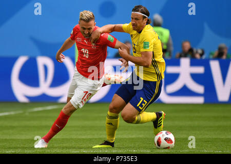St. Petersburg, Russland. 03rd July, 2018. Josip DRMIC (SUI), action, duels versus Gustav SVENSSON (SWE). Sweden (SWE) - Switzerland (SUI) 1-0, Round of 16, Round of 16, Game 55, on 07/03/2018 in Saint Petersburg, Arena Saint Petersburg. Football World Cup 2018 in Russia from 14.06. - 15.07.2018. | usage worldwide Credit: dpa/Alamy Live News Stock Photo