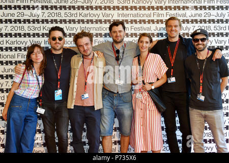 Karlovy Vary, Czech Republic. 03rd July, 2018. From left: co-producer Darina Maslona, producer Jan Kwiecinski, Polish director Pawel Maslona, screenwriter and actor Bartlomiej Kotschedoff, screenwriter and actress Aleksandra Pisula, director of photography Cezary Stolecki and Pisula's fiancee Lukas Gewalt pose in front of a photo wall at a news conference to Maslona's film Panic Attack during the 53rd International Film Festival in Karlovy Vary (KVIFF), Czech Republic, on July 3, 2018. Credit: Slavomir Kubes/CTK Photo/Alamy Live News Stock Photo