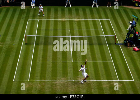 London, England - July 4th, 2018.  Wimbledon Tennis:  Roger Federer serving to Lukas Lacko of Slovakia during their second round match today at Wimbledon Credit: Adam Stoltman/Alamy Live News Stock Photo